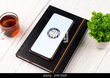 West Bangal, India - December 15, 2021 : Dhan logo on phone screen stock image. Stock Photo