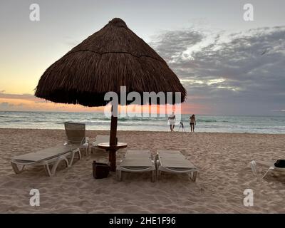 Playa del Carmen, Quintana Roo, Mexico - December 15, 2021: People enjoying the white sand tropical beach in Riviera Maya. Stock Photo