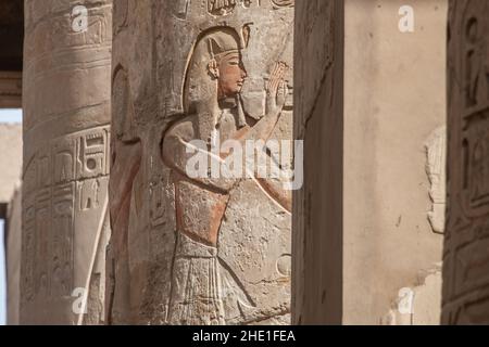 A relief on one of the pillars in the Hypostyle hall in Karnak temple, an archeological site in Egypt. Stock Photo