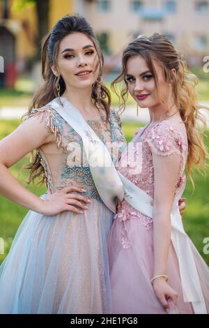 Beautiful schoolgirls in dress at the prom at school. Stock Photo