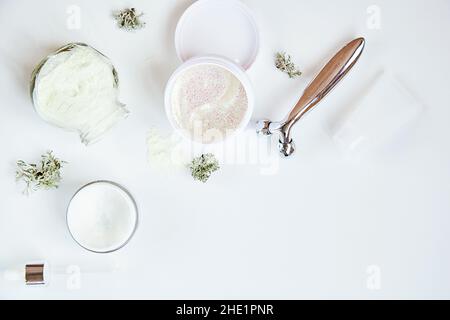 Alginate mask and transparent patches. Wellness face care cosmetics set on white gradient background. Cream and massager. Natural moss. Hyaluronic and moisturizing cosmetic. Dermatology products.