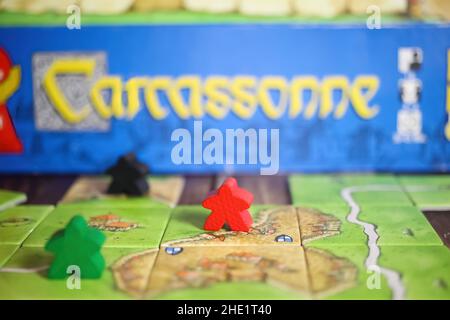 Viersen, Germany - May 9. 2021: Closeup of tile based original strategy board game Carcassonne Stock Photo