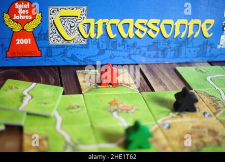 Viersen, Germany - May 9. 2021: Closeup of tile based original strategy board game Carcassonne Stock Photo