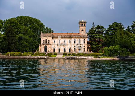 View of Villa Erba, a 19th-century villa  in the suburb Cernobbio, across Lake Como from a ferryboat.