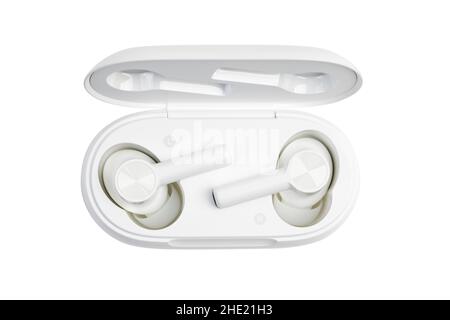 Closeup white TWS (true wireless stereo) earbuds in case isolated on white background. Stock Photo