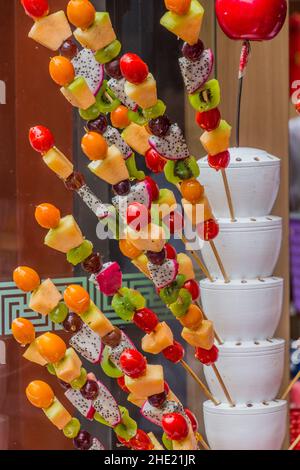 Fruits on skewers, street food in Beijing, China Stock Photo