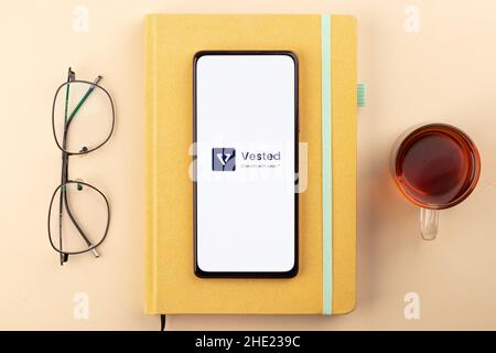 West Bangal, India - December 15, 2021 : Vested logo on phone screen stock image. Stock Photo