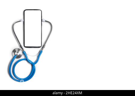 Doctor online consultation concept. Stethoscope and mockup smartphone isolated on white background. Mobile medical application in cell phone with heal Stock Photo