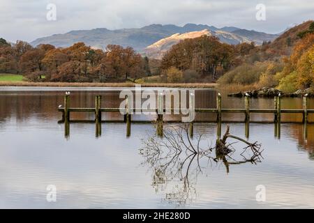 jetty on windermere with early morning light on background hills Stock Photo