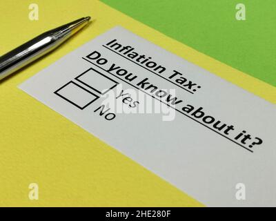One person is answering question about inflation tax. Stock Photo