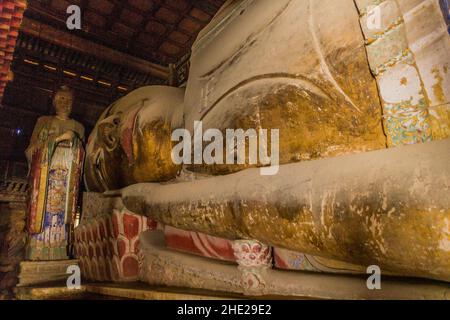 ZHANGYE, CHINA - AUGUST 23, 2018: Reclining Buddha in Giant Buddha Dafo Temple in Zhangye, Gansu Province, China