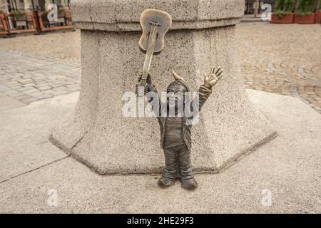 Guitar Player dwarf (Leszko) in honor of Guitar Guinness World Record - since 2005 hundreds of wroclaw dwarf figurines appeared in the city - Wroclaw, Stock Photo