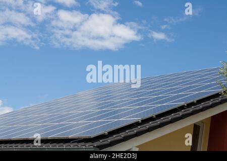 A roof of a home full of Solar Systems Stock Photo