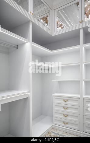 White windowless walk-in closet with tall cabinet in the middle Stock Photo  - Alamy