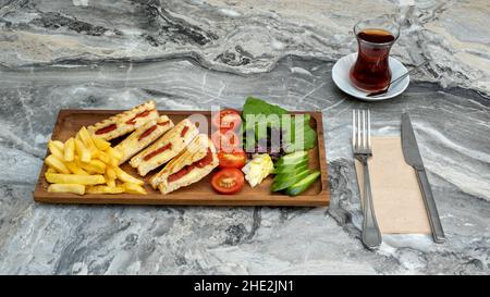 toast in wooden serving platter on marble background Stock Photo