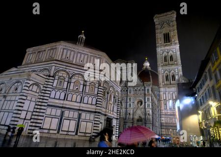 Florence, Italy: Dome of Santa Maria del Fiore and Battistero di San Giovanni, Piazza San Giovanni  in the night in city lights Stock Photo