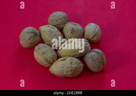 Walnuts on a red background Stock Photo