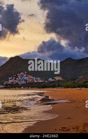 Las Teresitas Beach with the town of San Andrés on Tenerife at sunset in December Stock Photo