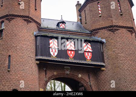 Coats of arms above the entrance gate of castle 'De Haar' near the village of Haarzuilens, the Netherlands. Stock Photo