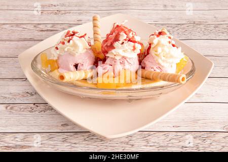 In its simplest form, ice cream or frozen cream is a frozen food that is usually made from dairy products such as milk or cream, cookie wafers, and fr Stock Photo