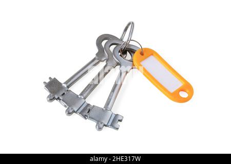 Bunch of keys on ring with tag isolated on white Stock Photo
