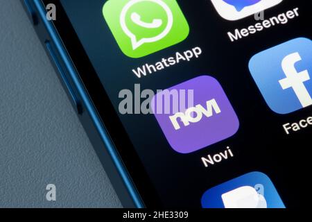 Novi app icon is seen on an iPhone. Novi from Meta enables users to send, spend, and receive digital payments in Messenger, WhatsApp and the Novi app. Stock Photo
