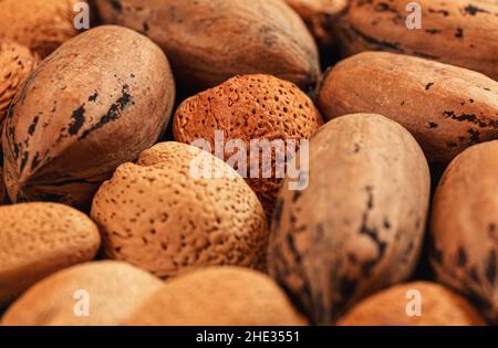 Mixed whole pecan nuts and almonds closeup detail Stock Photo