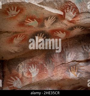 Prehistoric handprints at the Cave of the Hands (Spanish: Cueva de Las Manos ) in Santa Cruz Province, Patagonia, Argentina. The art in the cave dates Stock Photo