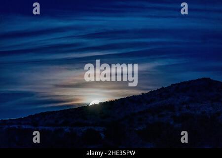Full moon rising; Rabbit Valley Camping Area; near Mack; Colorado; USA Stock Photo
