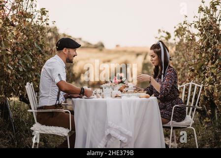 Beautiful view of a happy couple enjoying a romantic dinner Stock Photo