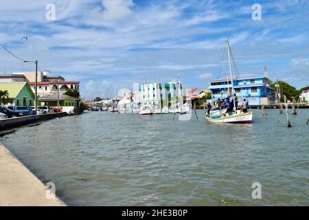 Fishermen going out to sea from the Belize City harbour. Stock Photo