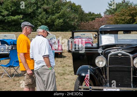 Two older men look at an unrestored 1931 Model A Ford at a Scottish festival in Virginia. Stock Photo
