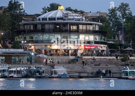 A McDonald's fast food restaurant on the bank of the Nile river in Aswan, Egypt in Northern Africa. Stock Photo