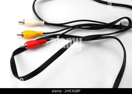 Red, white and yellow male cinch plugs, isolated on white background. Stock Photo