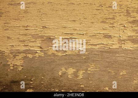 Faded yellow old paint on plywood Stock Photo