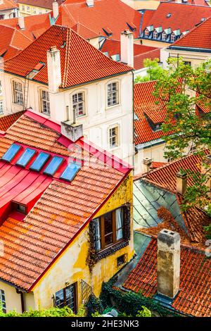 Old apartment buildings with red tiled roofs in Prague, Czech Republic Stock Photo