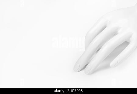 ladies' plastic white hand for rings on white background Stock Photo