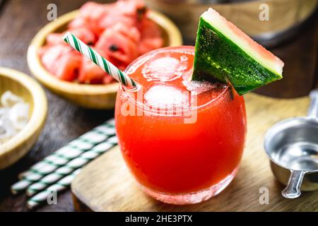 watermelon caipirinha, a cold Brazilian fruit drink made with cachaça and fruit, consumed in the summer. Stock Photo