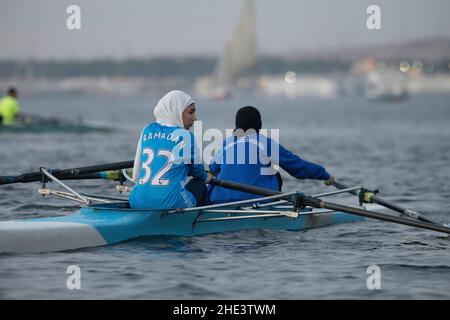 Egyptian women training in a double scull practicing rowing on the Nile River in Aswan, Egypt. Stock Photo