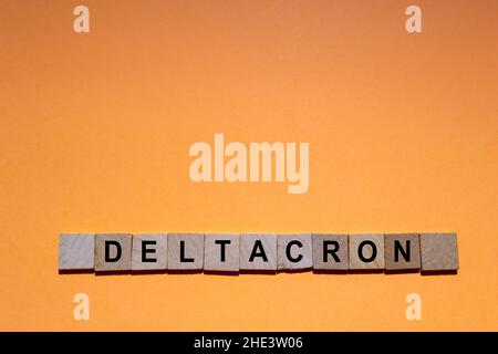 Deltacron. New variant of the SARS-CoV-2 Coronavirus. New combined version of the Delta variant and the Omicron variant. Text written on square pieces Stock Photo