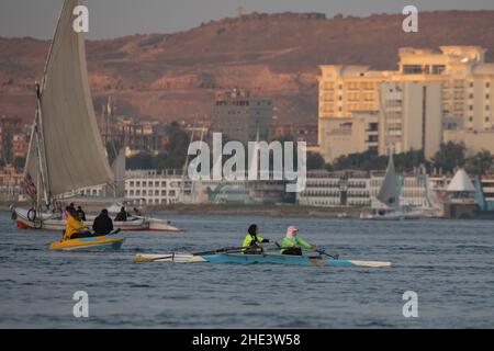 Female rowers training in a double scull on the Nile river in Aswan, Egypt. Stock Photo