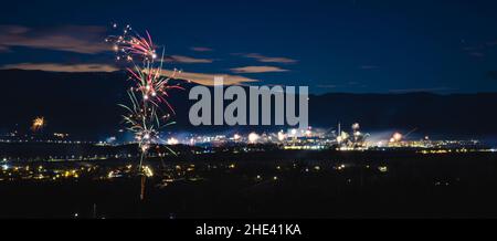 A panorama of fireworks on New Year's Eve. Stunning night city urban shot. . High quality photo Stock Photo