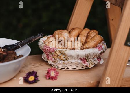 Close-up shot of fresh bakery products on a wooden table Stock Photo