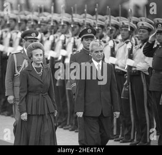 Then Romanian President and dictator Nicolae Ceausescu and his wife Elena Ceaușescu walk past a Chinese honor guard in Beijing during their state visit to China on October 14, 1988. On December 25 the following year (1989), they were executed by firing squad in Romania. Stock Photo