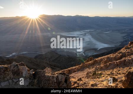 Sunburst Over Badwater Basin in Death Valley National Park Stock Photo