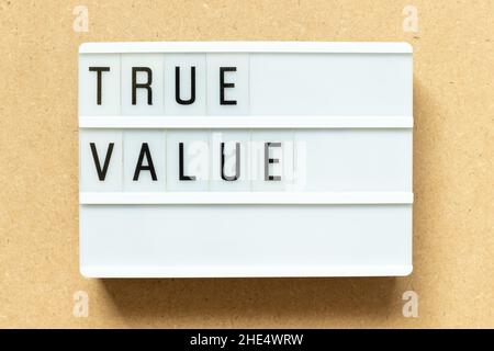 Lightbox with word true value on wood background Stock Photo