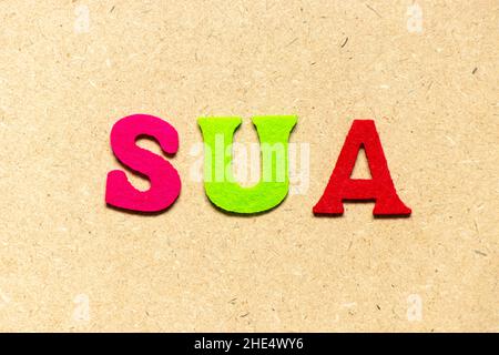Color cloth alphabet letter in word SUA (Abbreviation of Single use account) on wood background Stock Photo