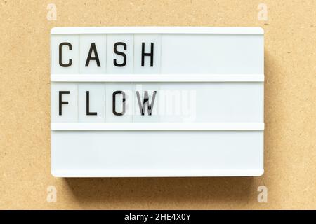 Lightbox with word cash flow on wood background Stock Photo