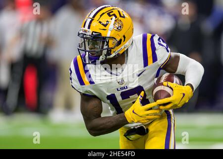 Houston, TX, USA. 4th Jan, 2022. LSU Tigers quarterback Jontre Kirklin (13) carries the ball during the 2nd quarter of the Texas Bowl NCAA football game between the LSU Tigers and the Kansas State Wildcats at NRG Stadium in Houston, TX. Trask Smith/CSM/Alamy Live News Stock Photo
