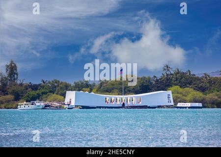 USS Arizona memorial at Pearl Harbor on Oahu in Hawaii, a graveyard for the men lost aboard the ship when it sank during the Pearl Harbor attack and a Stock Photo